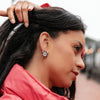 Model in the Bridget Enamel Nautical Ship's Wheel Stud Earrings - Navy & White
