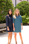 Two models, left woman wearing Jude Connally Henley Dress in Denim Navy