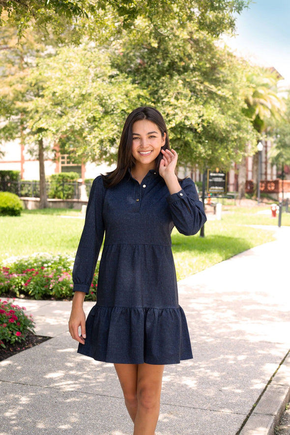 Model outside in Jude Connally Henley Dress in Denim Navy