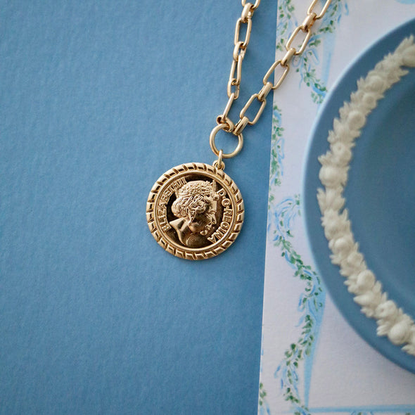 Flat view of the Queen Elizabeth Coin Necklace in Worn Gold