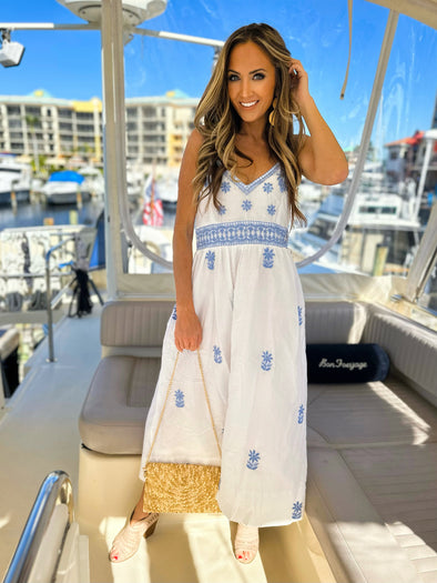 Model on boat wearing Gretchen Scott Fiesta Time Dress in White/Periwinkle