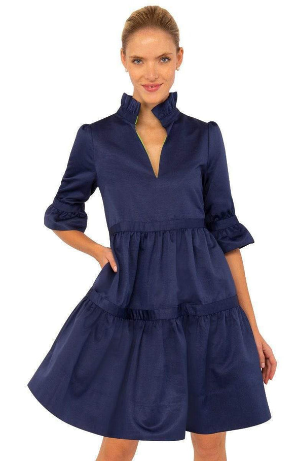 Front view of the teardrop dress. Navy blue with tiered levels with ruffle sleeves