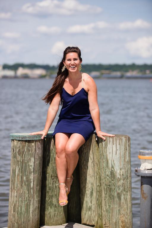 Model on pier wearing Jude Connally Bailey Dress in Navy