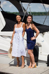 Two models on pier, right wearing Jude Connally Bailey Dress in Navy