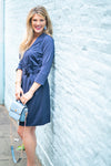 Side view of model outside wearing Gretchen Scott Dapper Dress in Solid Navy
