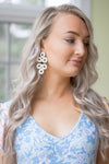 Model in the Lisi Lerch Straw Ginger Earrings - White