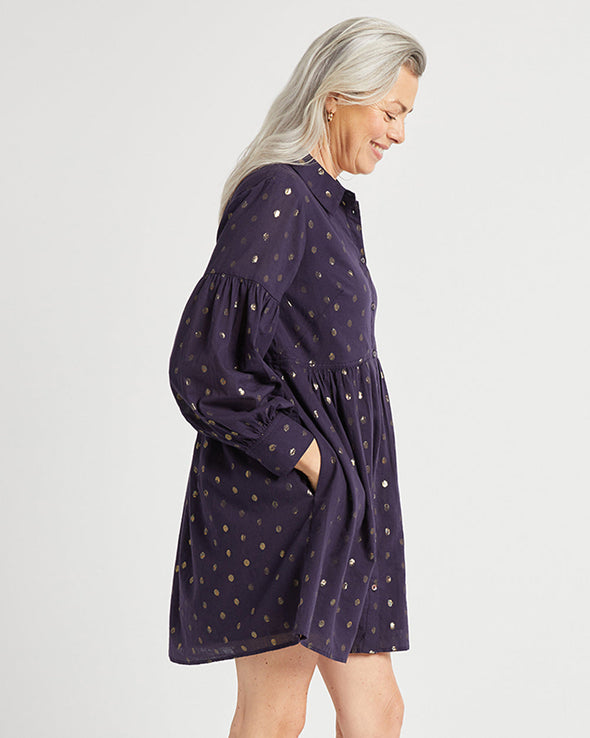 Side view of Jude Connally Briar Dress in Navy/Gold Dot