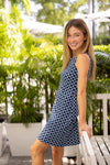 Side view of model outside in Jude Connally Beth Dress in Circle Geo Navy