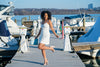 Playful outdoor model in French Connection Demi Dress - Summer White
