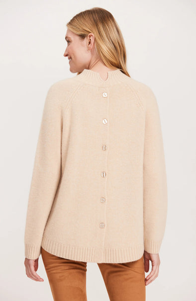 Back view of model in the Tyler Böe Cashmere Button Back Sweater - Almond