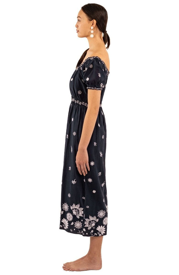 Side view of model in Gretchen Scott Big Love Maxi Dress - Navy