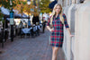 Outdoor model in the Gretchen Scott Ruff Neck Jersey Dress - Duke Of York - Black/Multi