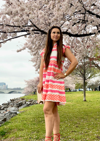 Outdoor model in the Sail to Sable Flutter Sleeve Fit & Flare Dress - Pink/Orange