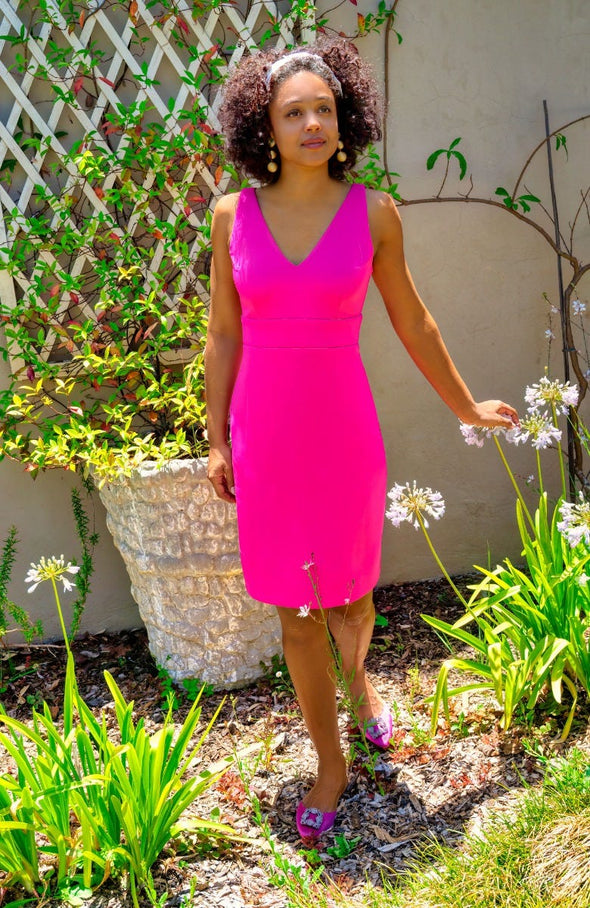 Model outside in Gretchen Scott Harlot Dress in Solid Pink
