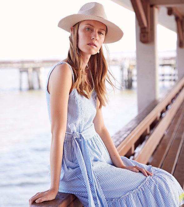 Sitting model in the Hatley Sydney Midi Dress - Seersucker